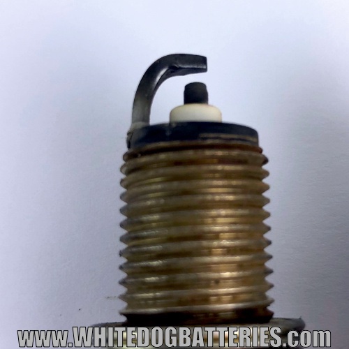 Used spark plug electrode with worn edges